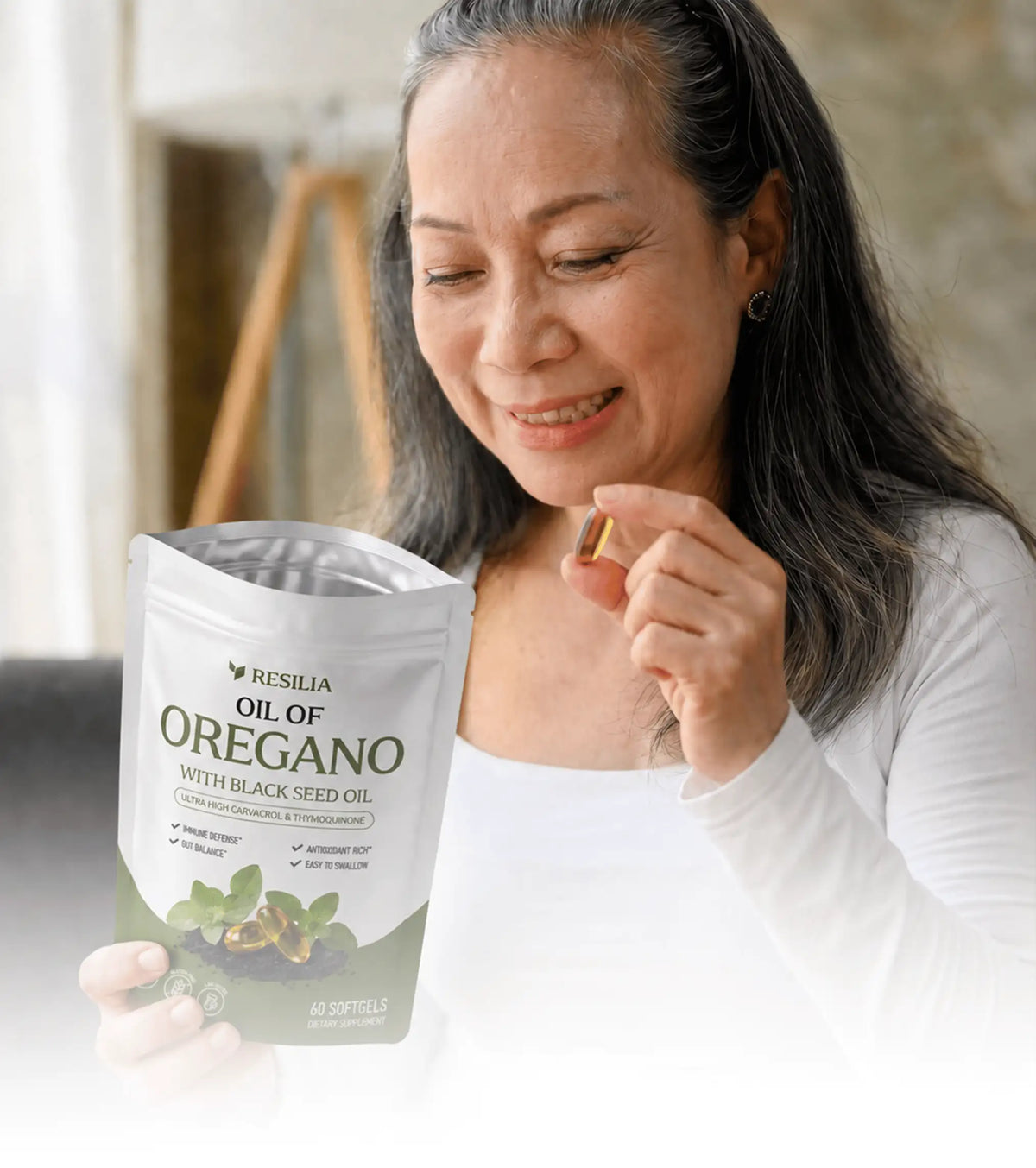 Woman holding a wellness supplement